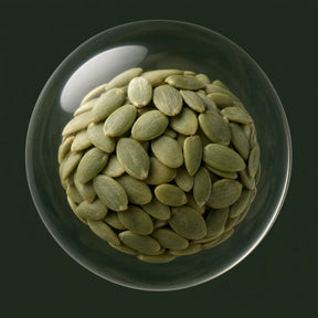Cold-pressed pumpkin seed oil in a glass orb