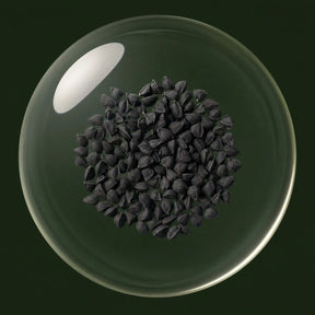 Cold-pressed black seed oil in a glass orb