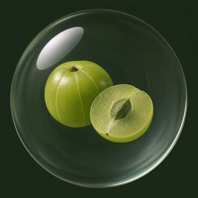 Sun-dried amla fruit steeped in oil in a glass orb