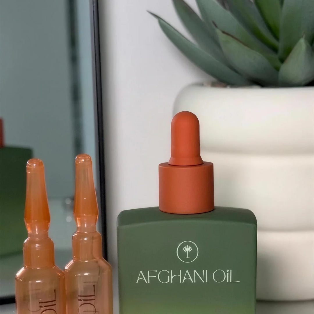 Original Afghani Hair Oil beside individual Protocol ampoules